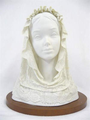 Lot 123 - A Lladro White Porcelain Bust of a Young Girl Wearing a Rose Trimmed Veil, 20th century, gazing...