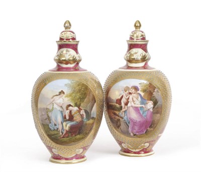 Lot 127 - A Pair of Continental "Vienna Style" Porcelain Ovoid Vases and Covers, circa 1900, decorated...