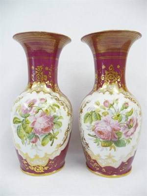 Lot 135 - A Pair of Continental Porcelain Rose Painted and Ruby Ground Baluster Vases, circa 1870, with...