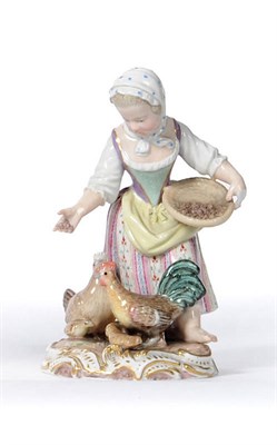 Lot 141 - A Meissen Porcelain Figure of a Young Girl Feeding Poultry, circa 1880, scattering corn from a...