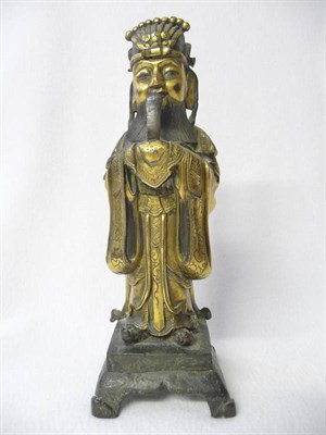 Lot 164 - A Chinese Gilt Bronze Figure of a Scholar, 17th/18th century, standing holding a ruyi sceptre...