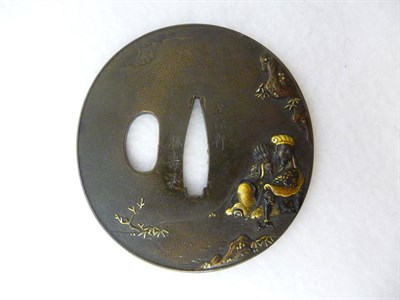 Lot 166 - A Japanese Mixed Metal Tsuba, 19th century, oval, worked on one side with a seated deity...