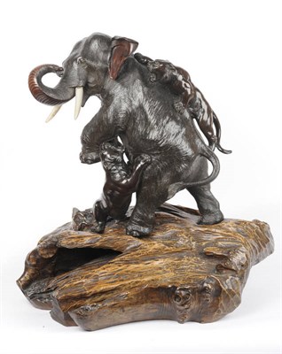 Lot 172 - A Japanese Bronze Elephant and Tiger Group, late Meiji Period (1868-1912), the rearing bull...