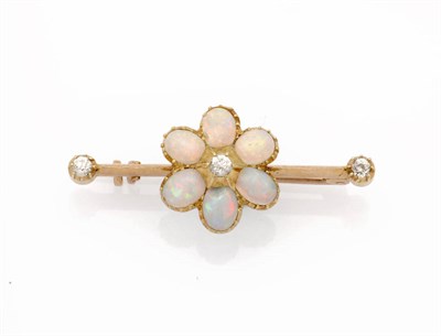 Lot 207 - A Diamond and Opal Bar Brooch, a floral centre of an old cut diamond bordered by six cabochon...