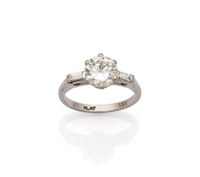 Lot 210 - A Diamond Solitaire Ring with Diamond Set Shoulders, the round brilliant cut diamond in a white six