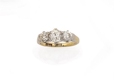 Lot 223 - A Diamond Three Stone Ring, the graduated old cut diamonds held in white claw settings to a...