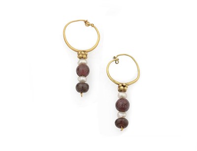 Lot 228 - A Pair of Garnet and Pearl Drops, a hoop suspends a cluster of granulated gold and two pearls...