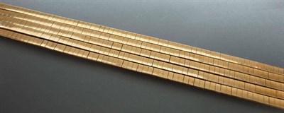 Lot 239 - A Five Row Brick Link Bracelet, the articulated yellow brick links held in five strands to a...