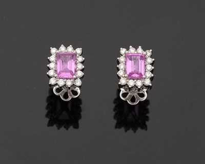 Lot 245 - A Pair of Pink Sapphire and Diamond Cluster Earrings, the baguette cut pink sapphires in white four