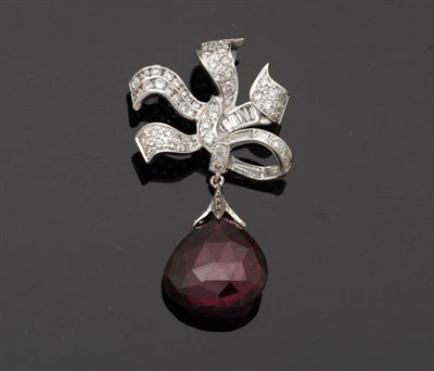 Lot 246 - A Pink Tourmaline and Diamond Pendant, the briolette tourmaline hangs from a diamond set bow...