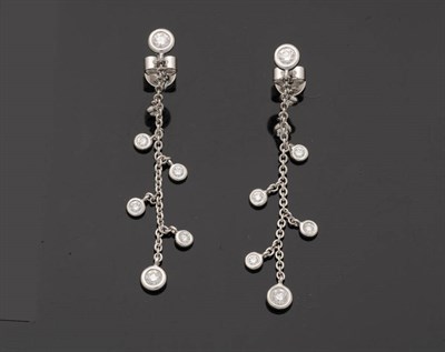 Lot 247 - A Pair of 18 Carat White Gold Fancy Diamond Drop Earrings, a round brilliant cut diamond stud...