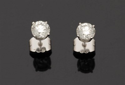 Lot 250 - A Pair of Platinum Diamond Solitaire Stud Earrings, the round brilliant cut diamonds held in...