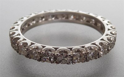 Lot 258 - A Diamond Eternity Ring, the eight-cut diamonds held in white claw settings on a plain polished...