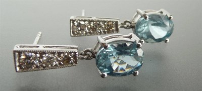 Lot 262 - A Pair of Aquamarine and Diamond Earrings, graduated round brilliant cut diamonds in a tapered...