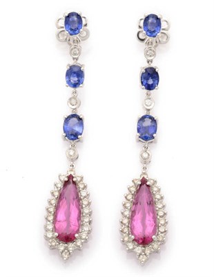 Lot 263 - A Pair of Pink Tourmaline, Sapphire and Diamond Drop Earrings, a series of three oval cut claw...