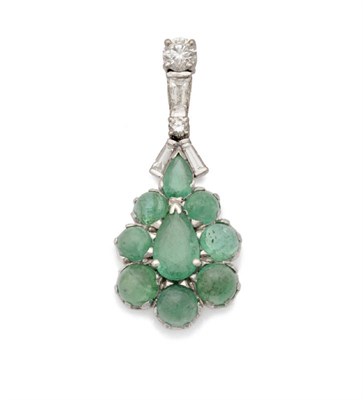 Lot 271 - An 18 Carat White Gold Emerald and Diamond Pendant, a cluster of two pear cut emeralds and...