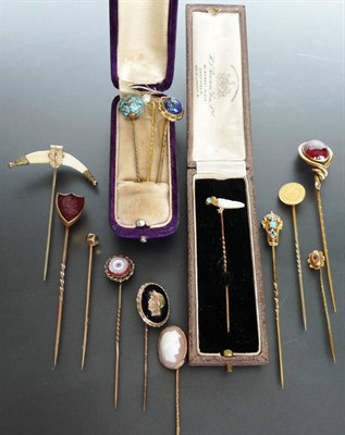 Lot 285 - A Collection of Fourteen Stick Pins, including a bird motif comprising a baroque pearl body holding