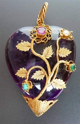 Lot 286 - A Heart Shaped Amethyst Pendant, the polished amethyst overlaid with gold detail in leaf and...