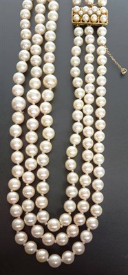 Lot 287 - A Graduated Three Row Cultured Pearl Necklace, the three rows strung to an oblong clasp set...