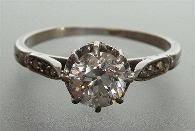 Lot 294 - A Diamond Solitaire Ring, a round brilliant cut diamond held in white claw settings to diamond...