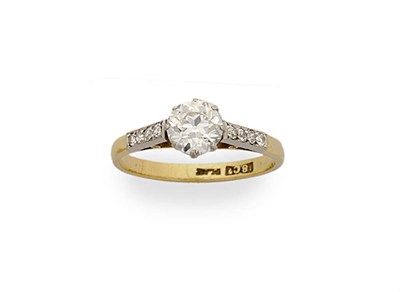 Lot 301 - A Diamond Solitaire Ring with Diamond Set Shoulders, the round brilliant cut diamond held in an...