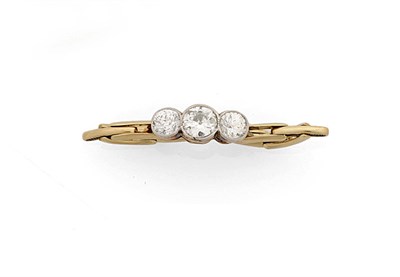 Lot 302 - A Diamond Three Stone Ring, the graduated old cut diamonds held in white millegrain settings to...