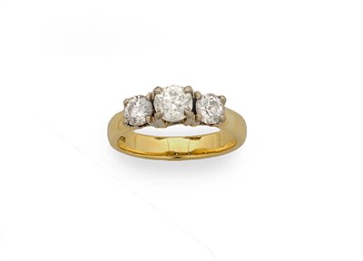 Lot 303 - An 18 Carat Gold Three Stone Diamond Ring, the old cut diamonds held in a modern white tiffany...