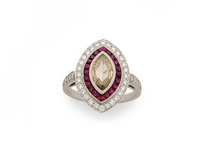 Lot 304 - A Diamond and Ruby Marquise Cluster Ring, a central marquise cut diamond sits within a border...