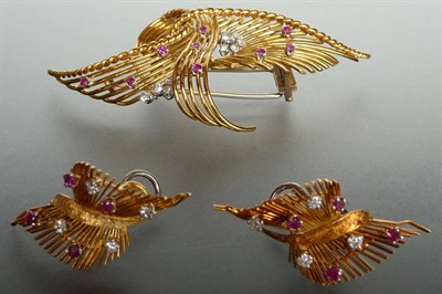 Lot 306 - A Ruby and Diamond Brooch and Matching Earrings, the stylised wire and rope effect brooch is...