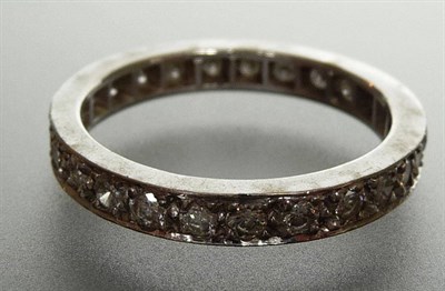 Lot 310 - An 18 Carat White Gold Diamond Eternity Ring, round brilliant cut diamonds held in white claw...