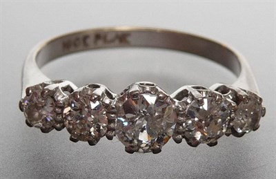 Lot 311 - A Diamond Five Stone Ring, the graduated old cut diamonds held in white claw settings, to a...