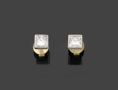 Lot 315 - A Pair of 18 Carat Gold Diamond Solitaire Stud Earrings, a princess cut diamond in a white...