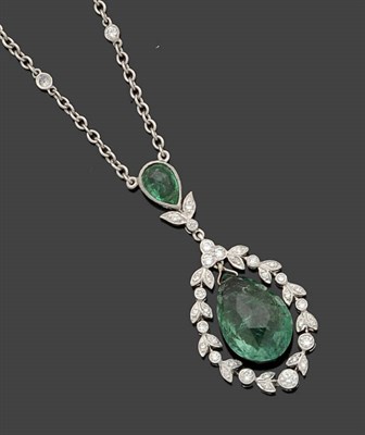 Lot 319 - An Emerald and Diamond Necklace, a pear cut emerald suspends a faceted pear shaped emerald within a