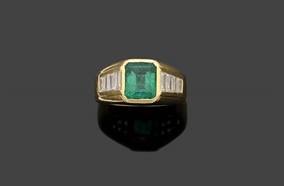 Lot 322 - An 18 Carat Gold Emerald and Diamond Ring, the emerald-cut emerald within a yellow rubover...