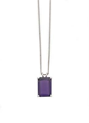 Lot 332 - An 18 Carat White Gold Amethyst Pendant on Chain, the baguette cut amethyst in a four claw...