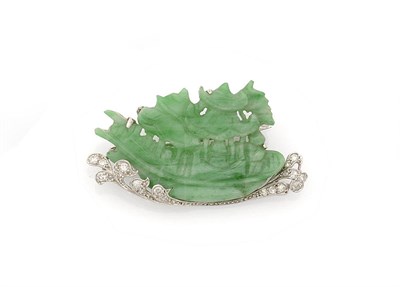 Lot 340 - A Jade and Diamond Brooch, a jade panel carved as a Chinese junk, over a swirling diamond set base