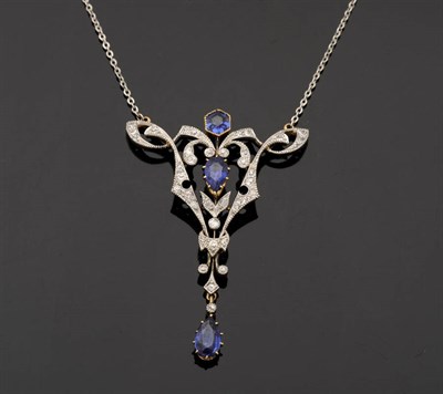 Lot 344 - A Sapphire and Diamond Pendant on Chain, the triangular pendant comprises diamonds in a pierced...