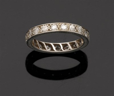 Lot 348 - A Diamond Full Eternity Ring, round brilliant cut diamonds claw set within a solid engraved...