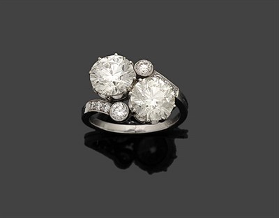 Lot 356 - A Diamond Two Stone Crossover Ring, the two principle old cut diamonds held in white claw...