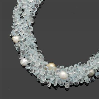 Lot 357 - An Aquamarine and Cultured South Sea Pearl Torsade, strands of faceted aquamarines with...