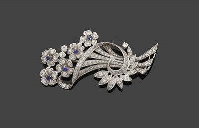 Lot 363 - A Sapphire and Diamond Floral Spray Brooch, the five flowerheads with sapphire centres sit atop the