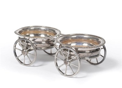 Lot 387 - A Victorian Plated Decanter Wagon, circa 1840-50, the twin circular gadrooned coasters raised...