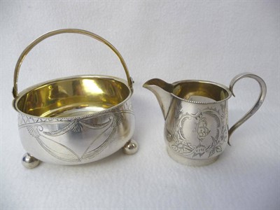 Lot 406 - A Russian Silver Sugar Bowl and Cream Jug, maker's mark NM, Moscow, circa 1900-10, circular...