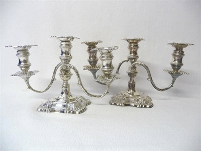 Lot 427 - A Pair of Edward VII Candelabra, William Hutton & Sons Ltd, Sheffield 1908, the shaped square bases