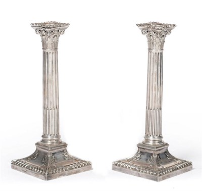 Lot 430 - A Pair of Edward VII Candlesticks, Hawksworth, Eyre & Co, Sheffield 1906, the square gadrooned...