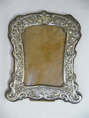 Lot 431 - An Edward VII Photograph Frame, W Neale, Chester 1904, shaped rectangular, embossed with carnations