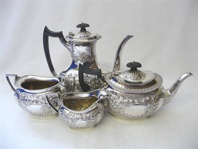 Lot 444 - A Victorian Four Piece Tea and Coffee Set, maker's mark J&T, Sheffield 1899, the foliate chased...