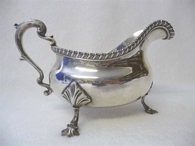 Lot 462 - A George IV Sauceboat, Pearce & Burrows, London 1827, of oval bellied form, raised on three...