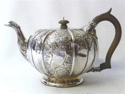 Lot 471 - A George III Teapot, Robert Garrard, London 1817, of spherical fluted form, chased with panels...