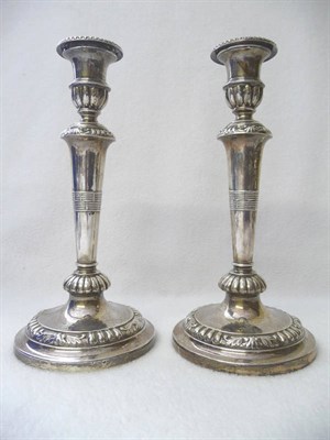 Lot 488 - A Pair of George III Candlesticks, John Roberts & Co, Sheffield 1809, the circular bases rising...